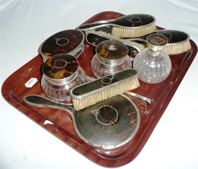 Lot 28 - Tortoiseshell and silver mounted dressing table set