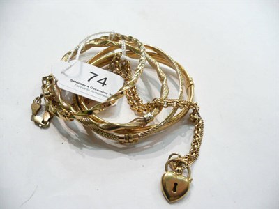 Lot 74 - Four 9 carat gold bangles and two bracelets