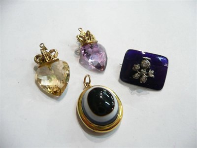Lot 79 - A citrine pendant, an amethyst pendant, a sardonyx pendant and a blue enamelled brooch