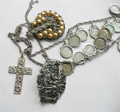 Lot 80 - A coin necklace, a silver cross on chain and two costume jewellery brooches