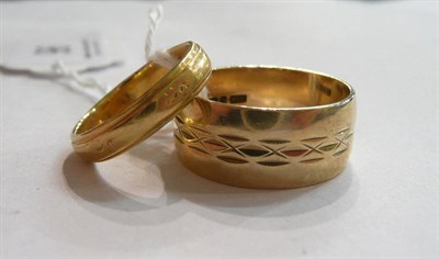 Lot 96 - An 18 carat gold band ring and a 9 carat gold ring