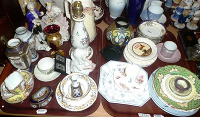 Lot 177 - Two trays of decorative ceramics including bisque piano baby, tea wares etc