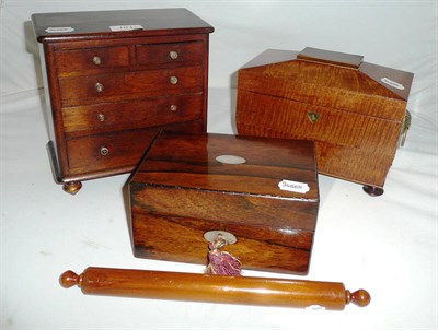 Lot 181 - Mahogany tea caddy, miniature chest of drawers, ruler and a rosewood box (4)