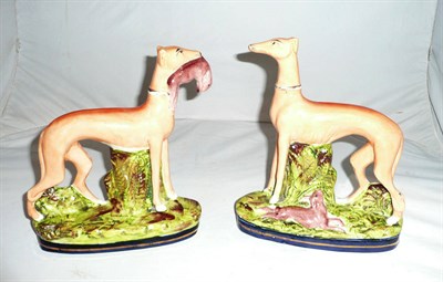 Lot 196 - Pair of Staffordshire dogs with moulded bases