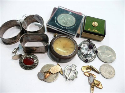 Lot 221 - Two silver napkin rings, a thistle brooch, a pocket watch, assorted cuff-links, an Ellesse...