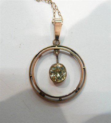 Lot 253 - An diamond pendant on chain, an old cut diamond suspends within a double disk frame, on a fine link