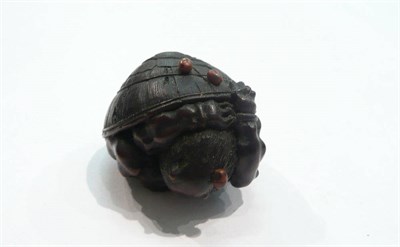 Lot 255 - A boxwood Netsuke, Oni under shell with snails