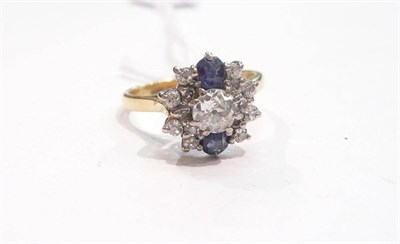 Lot 273 - A diamond and sapphire cluster ring, old brilliant and eight-cut diamonds in white claw settings to