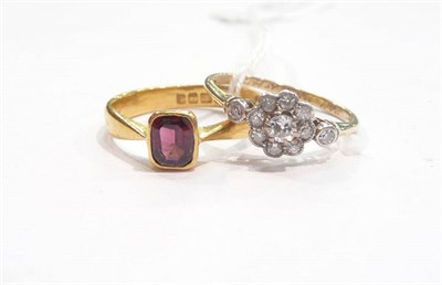 Lot 283 - A diamond set ring and a garnet set ring (2)