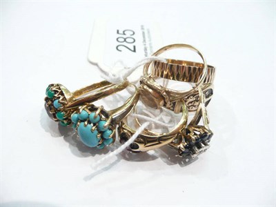 Lot 285 - A garnet and turquoise cluster ring, a 9 carat gold turquoise cluster ring, three stone set...