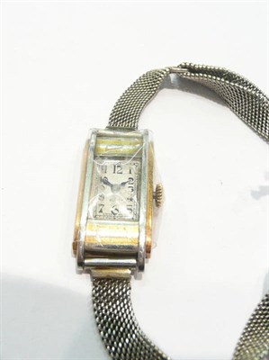 Lot 295 - A lady's 18ct two colour gold rectangular wristwatch, signed Zenith, 1928, 18-jewel lever...