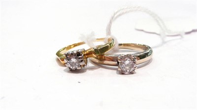 Lot 310 - Two 18 carat gold diamond solitaire rings