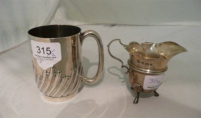 Lot 315 - A silver mug and a jug