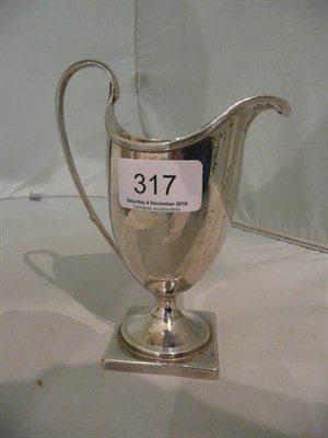 Lot 317 - Georgian silver helmet cream jug