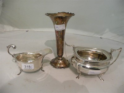 Lot 318 - Silver sauce boat, silver sugar basin and a vase, 27oz