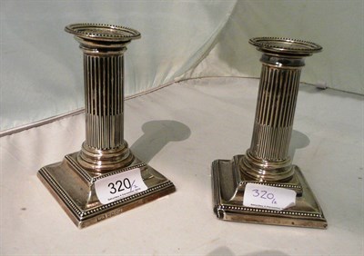 Lot 320 - A pair of silver candlesticks (loose sconces)