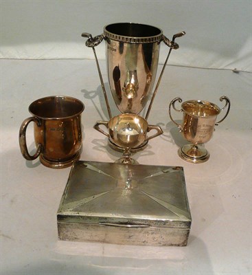 Lot 331 - Silver golfing trophy, two small trophy cups, cigarette box and a mug