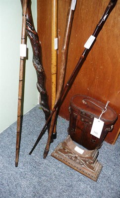 Lot 346 - Walking sticks, leather-cased binoculars and an oak stand