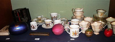 Lot 349 - Mouth organ, decorated caskets, tea wares, coronation china, etc on one shelf