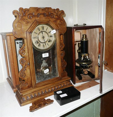 Lot 353 - American wall clock, scales and weights and a microscope