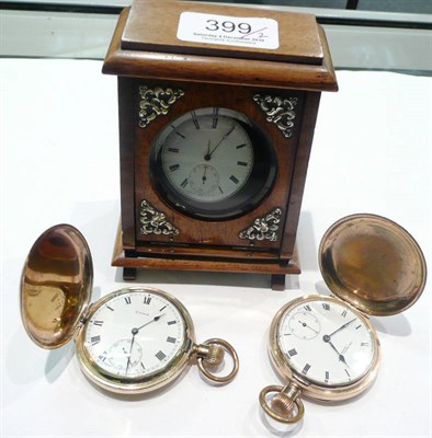 Lot 399 - A silver cased pocket watch, a wooden watch stand, two gold plated pocket watches