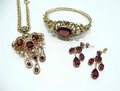 Lot 420 - A 9 carat gold fancy link chain with garnet pendant drop, a pair of garnet chandelier earrings...