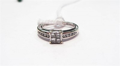 Lot 423 - Princess cut diamond cluster ring stamped '18K'