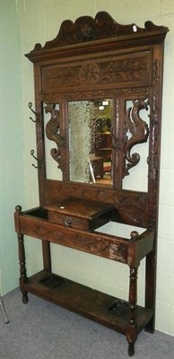 Lot 531 - A carved oak hall stand and a gilt mirror