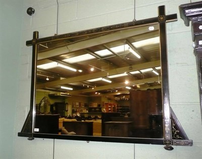 Lot 541 - Ebonised Aesthetic style wall mirror