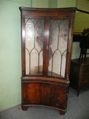 Lot 544 - A pair of mahogany glazed corner cabinets