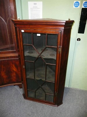 Lot 545 - Glazed mahogany hanging corner cupboard