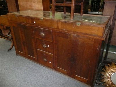 Lot 557 - Oak drapers cabinet