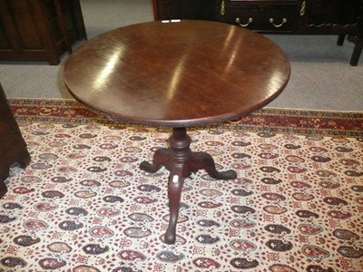 Lot 562 - A George III mahogany tripod table, late 18th century, the circular flip top above a bird cage...