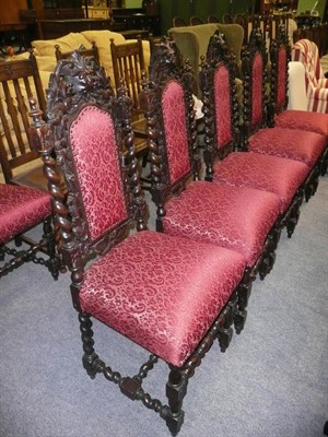 Lot 590 - Set of six carved oak upholstered seat and back chairs and a set of four oak dining chairs