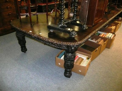 Lot 595 - Victorian carved oak extending dining table with five leaves