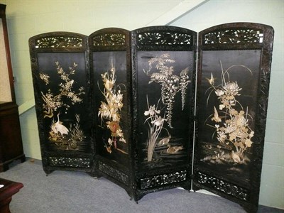 Lot 622 - Carved hardwood four panel folding screen