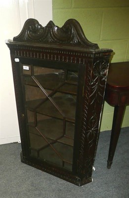 Lot 626 - Glazed carved oak hanging corner cupboard