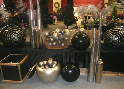 Lot 1049 - Decorations including, ten tall white metal vases, two large black vases, four black globes,...