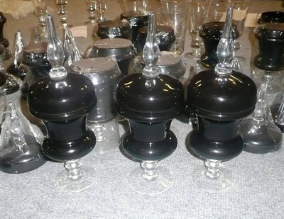 Lot 1059 - One hundred small glass black urns and covers