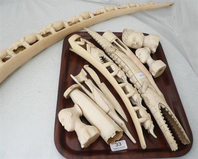Lot 33 - An Ivory tusk carved with elephants and nine other pieces