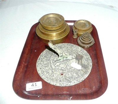 Lot 41 - A sundial and twelve brass weights
