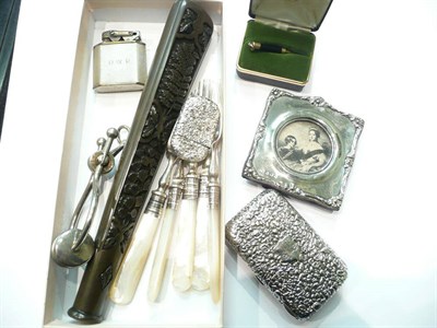 Lot 73 - Embossed silver cigarette case, vesta, silver photo frame, lighter, skirt lifter, parasol...