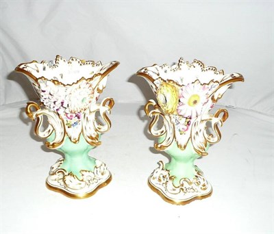 Lot 105 - A pair of flower encrusted vases, possibly Samuel Alcock