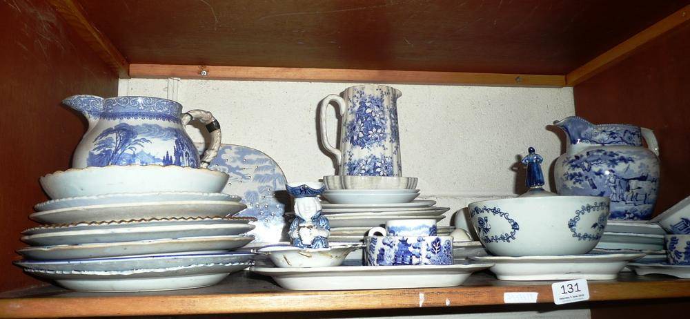 Lot 131 - Quantity of blue and white printed pottery on a shelf