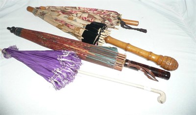 Lot 162 - An Edwardian parasol and three other later parasols