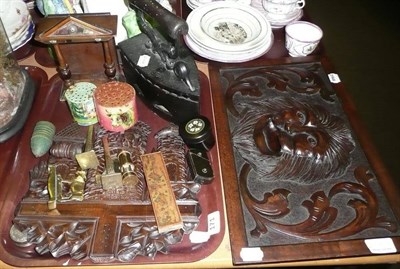 Lot 171 - Carved oak panel 'lion mask' and a tray including flat iron, carved panel, watch stand etc