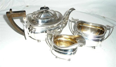 Lot 185 - A silver three piece teaset