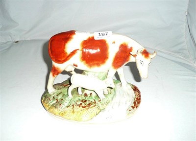 Lot 187 - Staffordshire figure group of cow and calf beside a stream