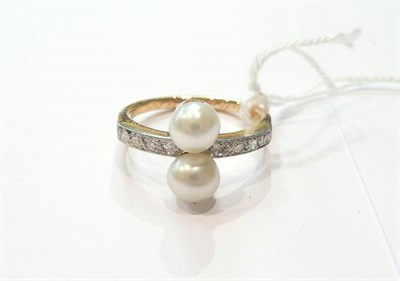 Lot 218 - A pearl and diamond ring.