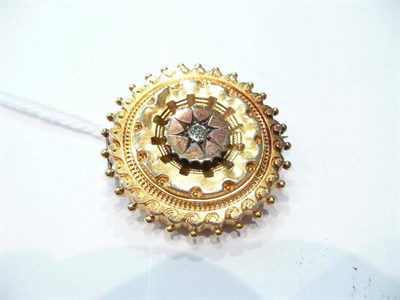 Lot 231 - A diamond set circular brooch